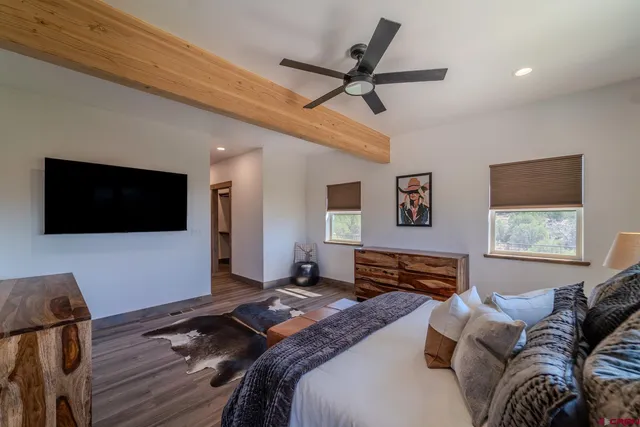 a bed room with a bed and a window