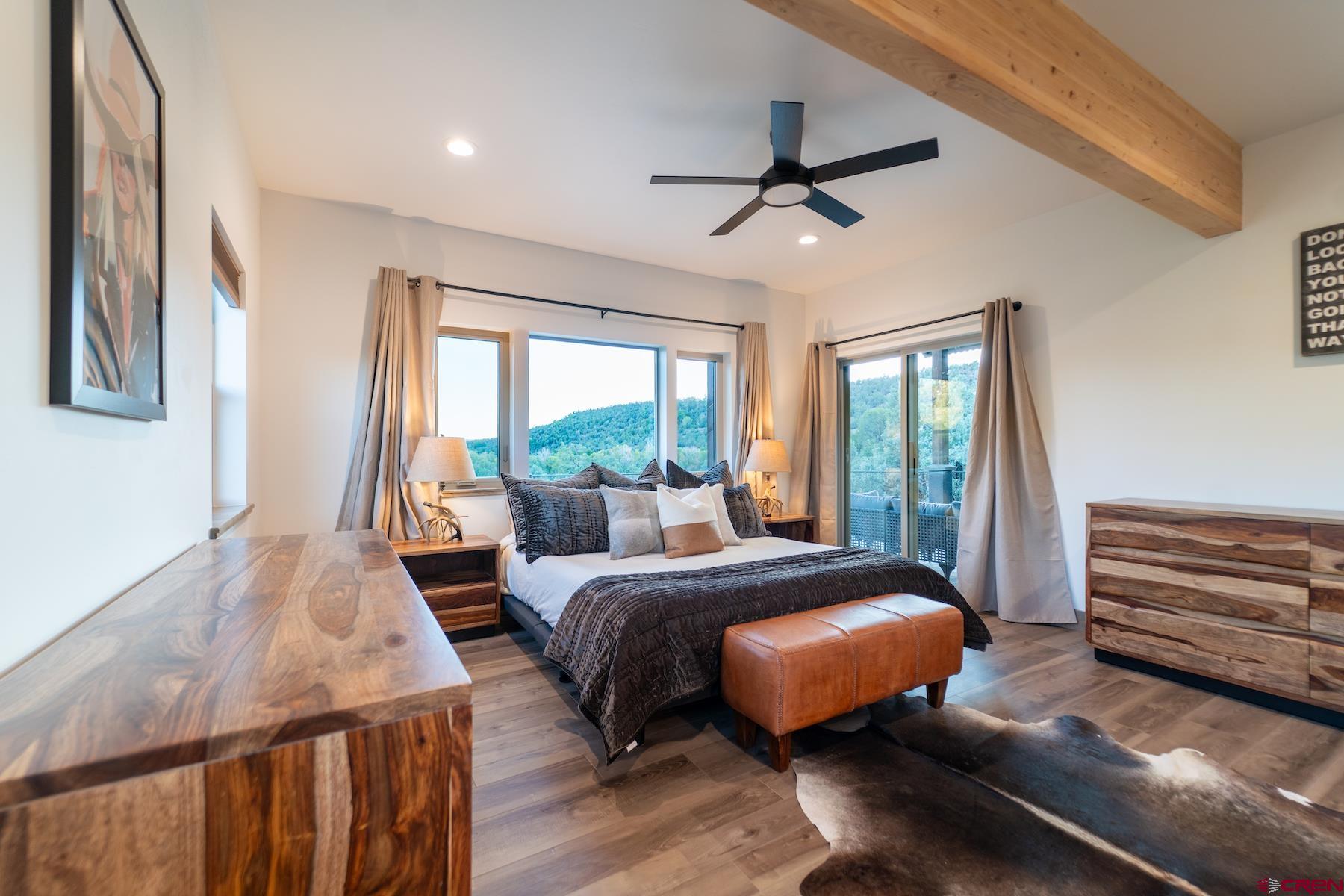 1700 Thoroughbred Road Durango, CO 81303 - Photo 21 of 45 a bed room with a bed and a window