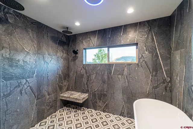 a bathroom with a shower and a toilet