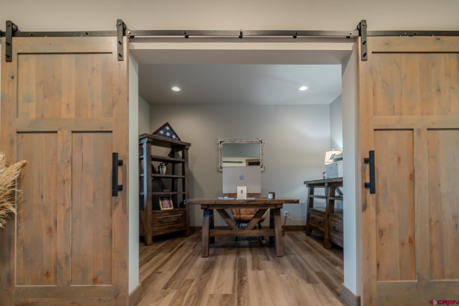 1700 Thoroughbred Road Durango, CO 81303 - Photo 26 of 45 a workspace with wooden floor and furniture