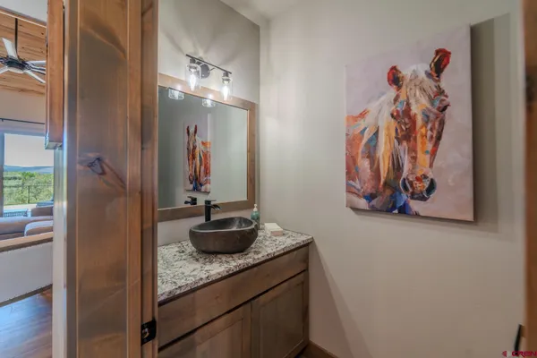 a bedroom with a bed and a night stand