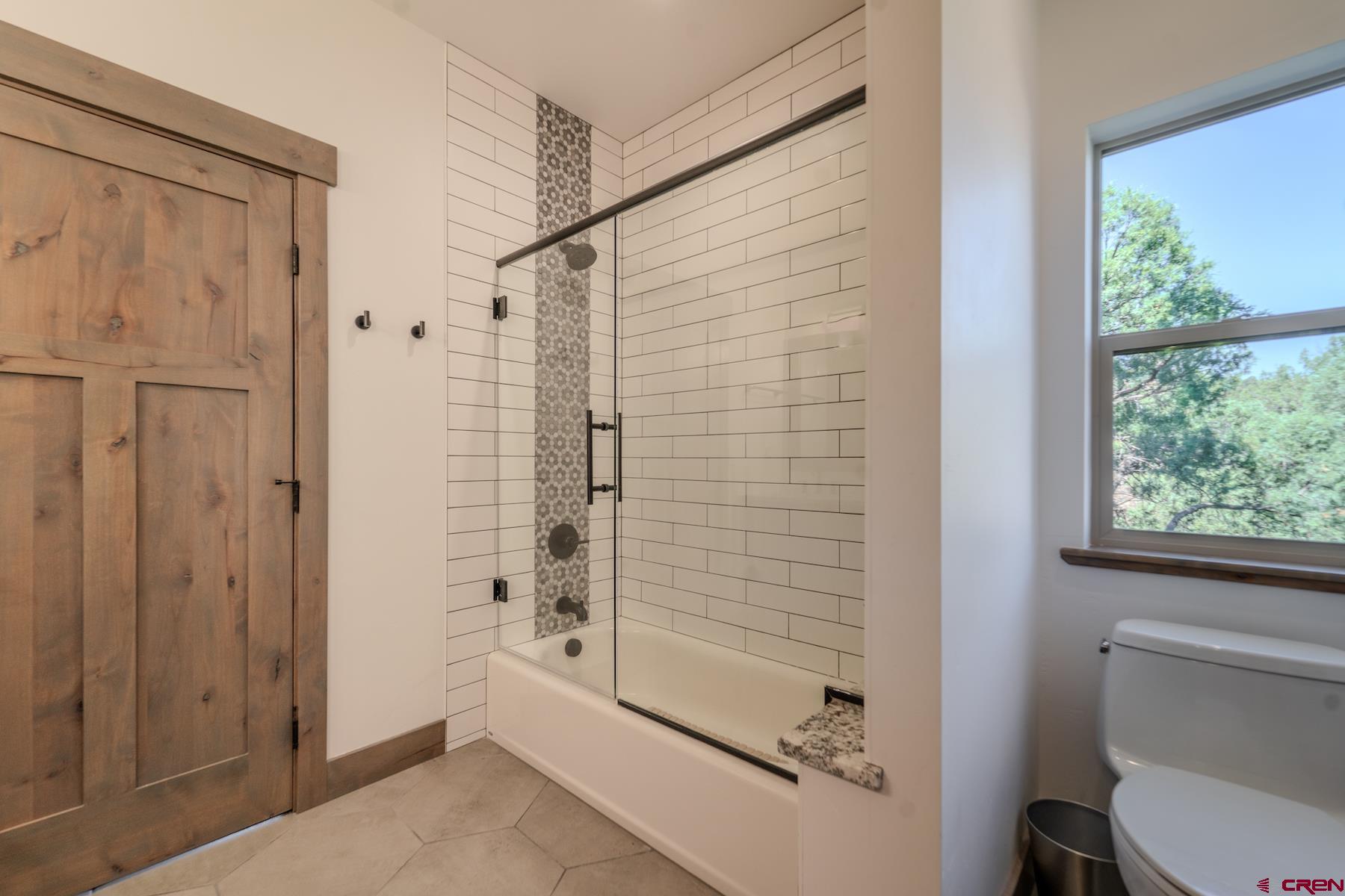 1700 Thoroughbred Road Durango, CO 81303 - Photo 30 of 45 a bathroom with a shower and a toilet