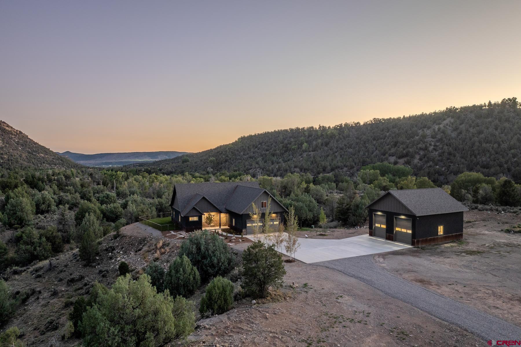 1700 Thoroughbred Road Durango, CO 81303 - Photo 3 of 45 a front view of a house with a big yard