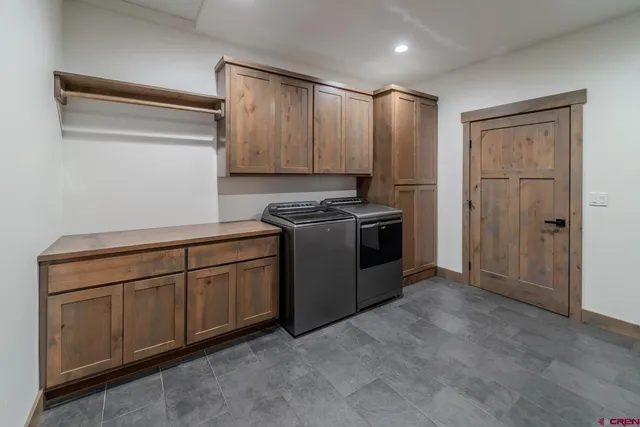 a kitchen with a refrigerator and a sink