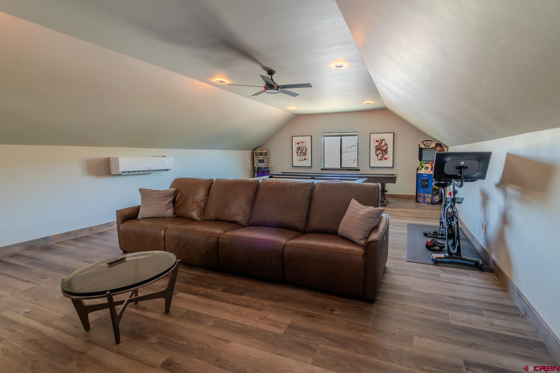1700 Thoroughbred Road Durango, CO 81303 - Photo 34 of 45 a living room with furniture and a wooden floor