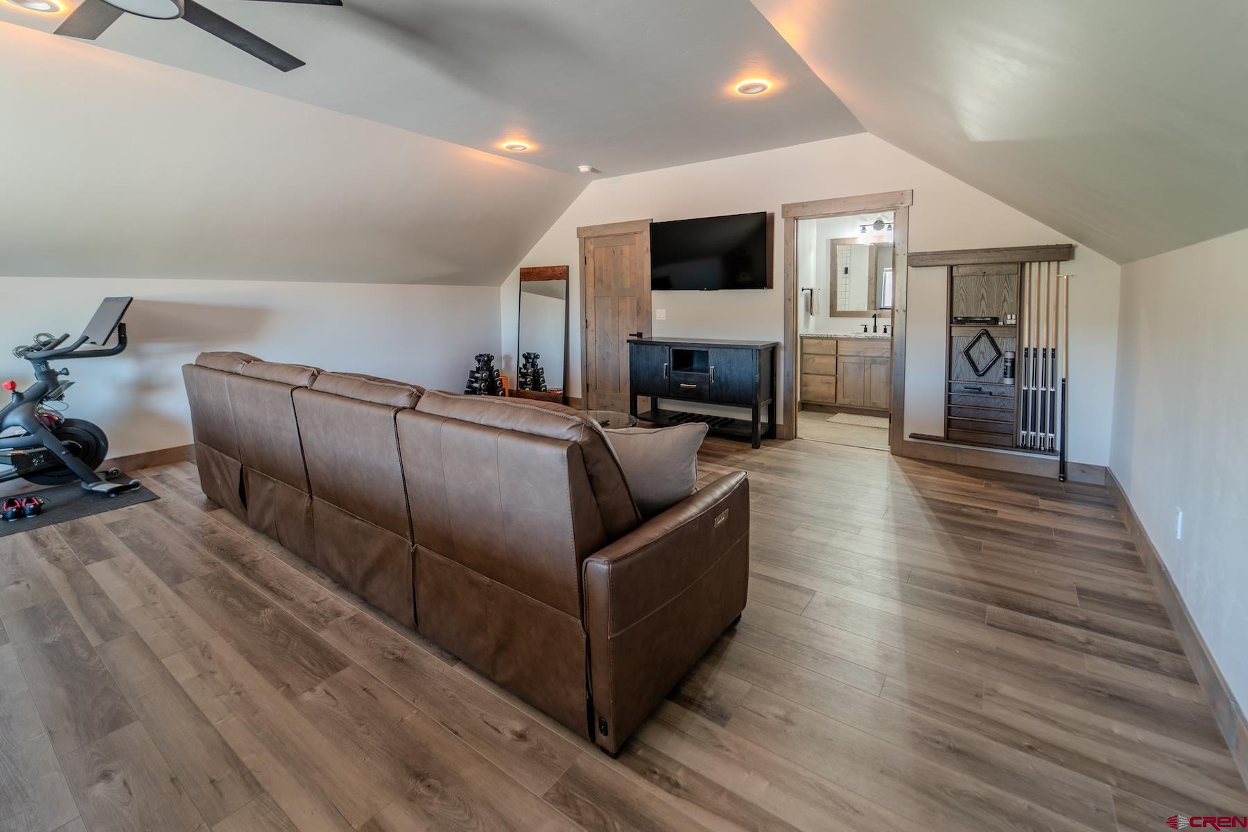 1700 Thoroughbred Road Durango, CO 81303 - Photo 37 of 45 a living room with furniture and a flat screen tv