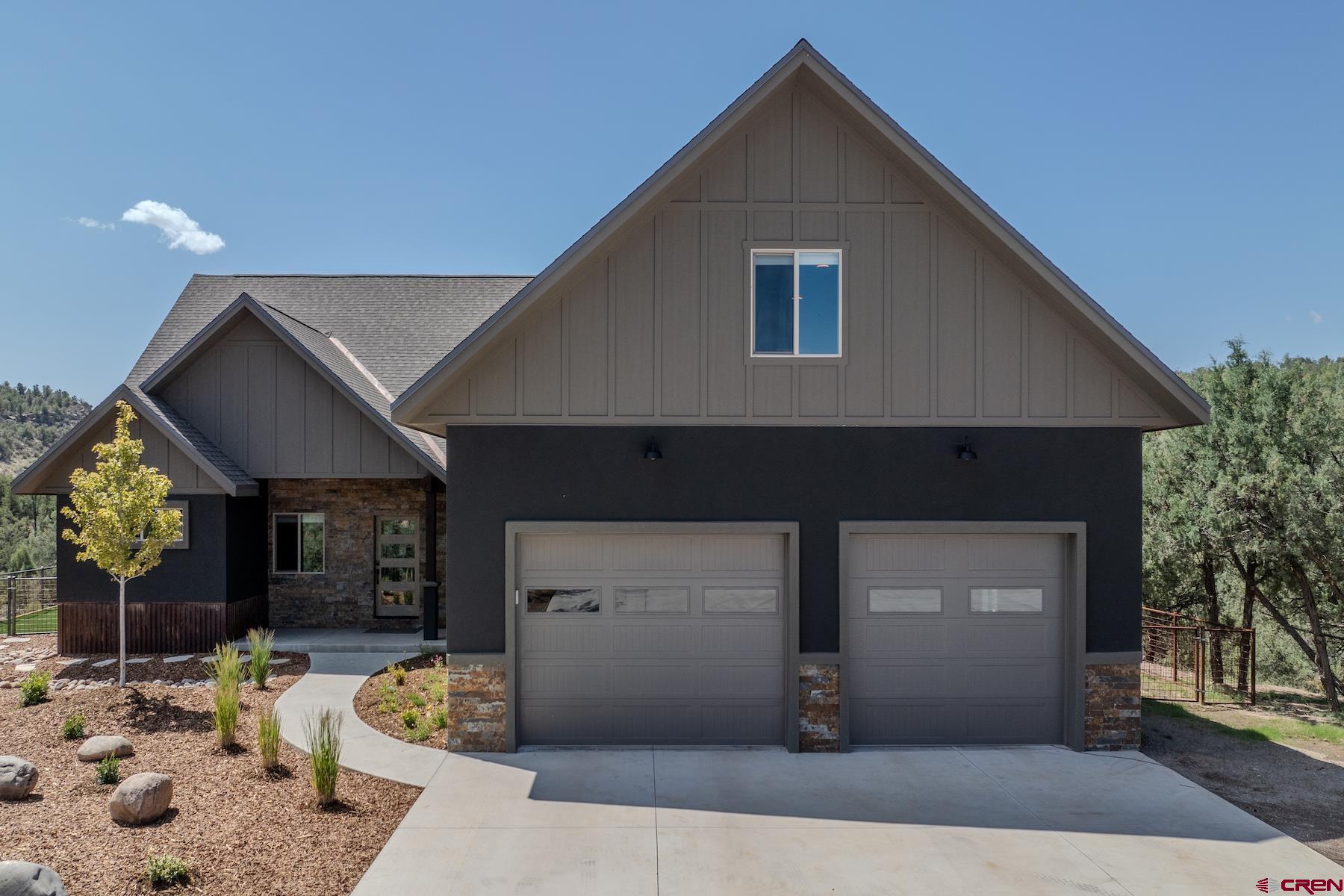 1700 Thoroughbred Road Durango, CO 81303 - Photo 7 of 45 a front view of a house with a yard