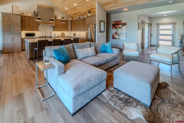a living room with furniture and a rug