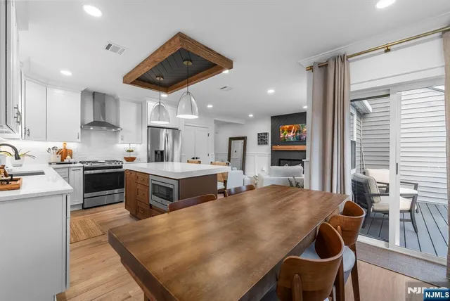 a bedroom with a bed and a wooden floor