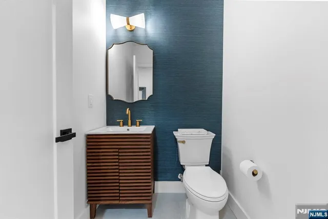 a spacious bedroom with a bed and a dresser