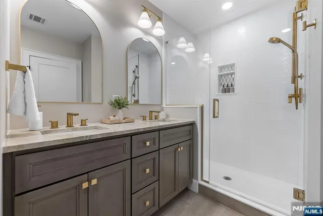 a bedroom with furniture and a flat screen tv