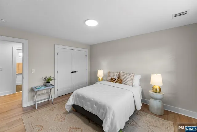 a bathroom with a toilet a sink and a mirror