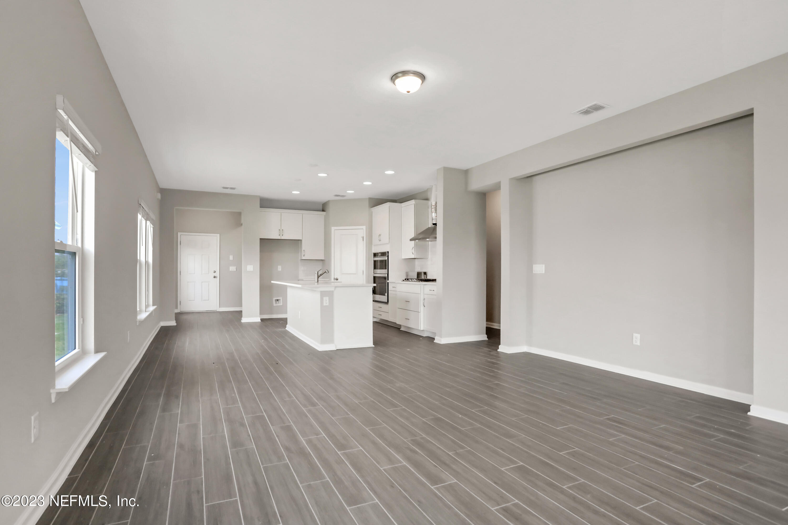 152 Torres Trace St. Augustine, FL 32095 - Photo 14 of 32 a view of a kitchen with wooden floor and a window