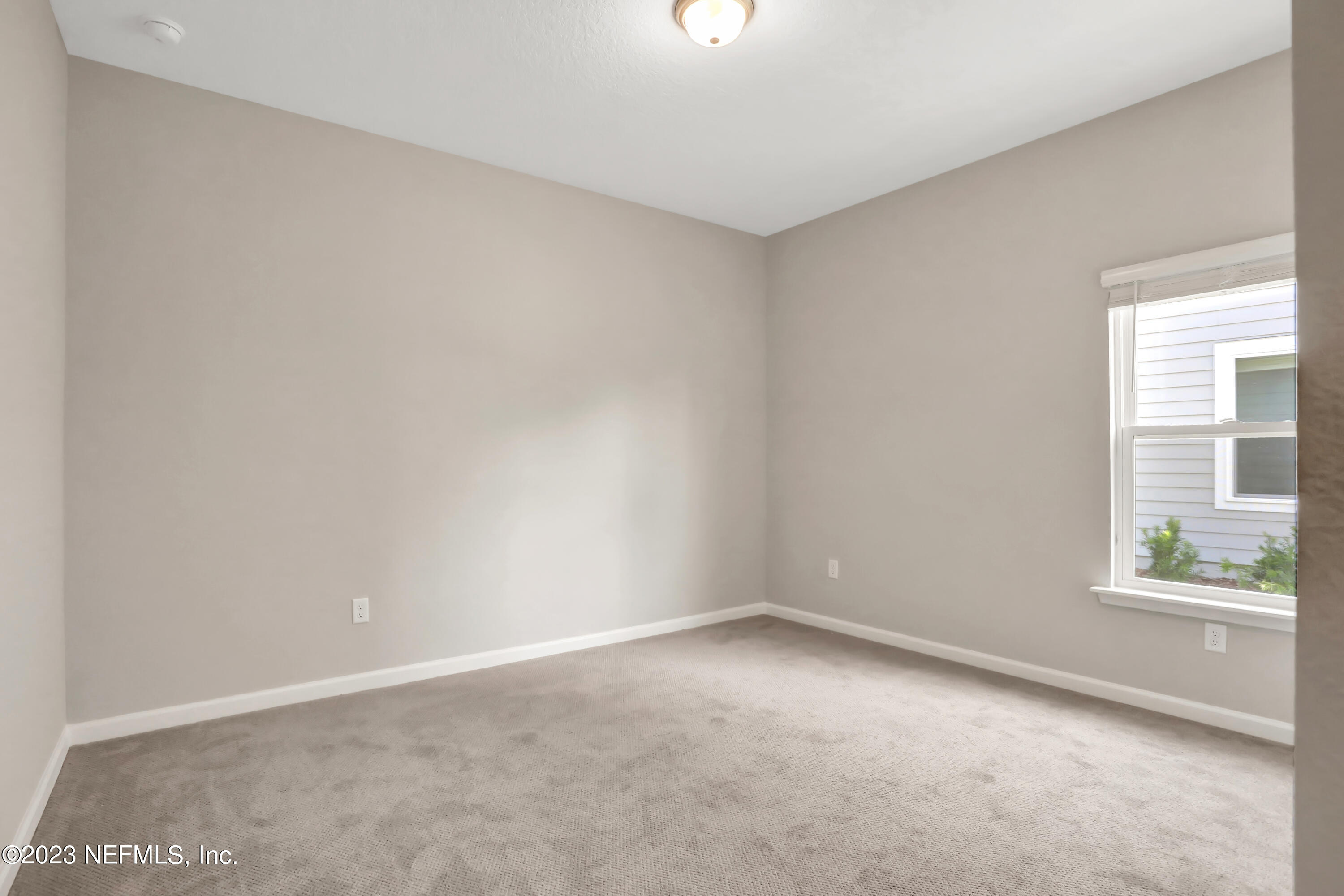 152 Torres Trace St. Augustine, FL 32095 - Photo 16 of 32 a view of an empty room with a window
