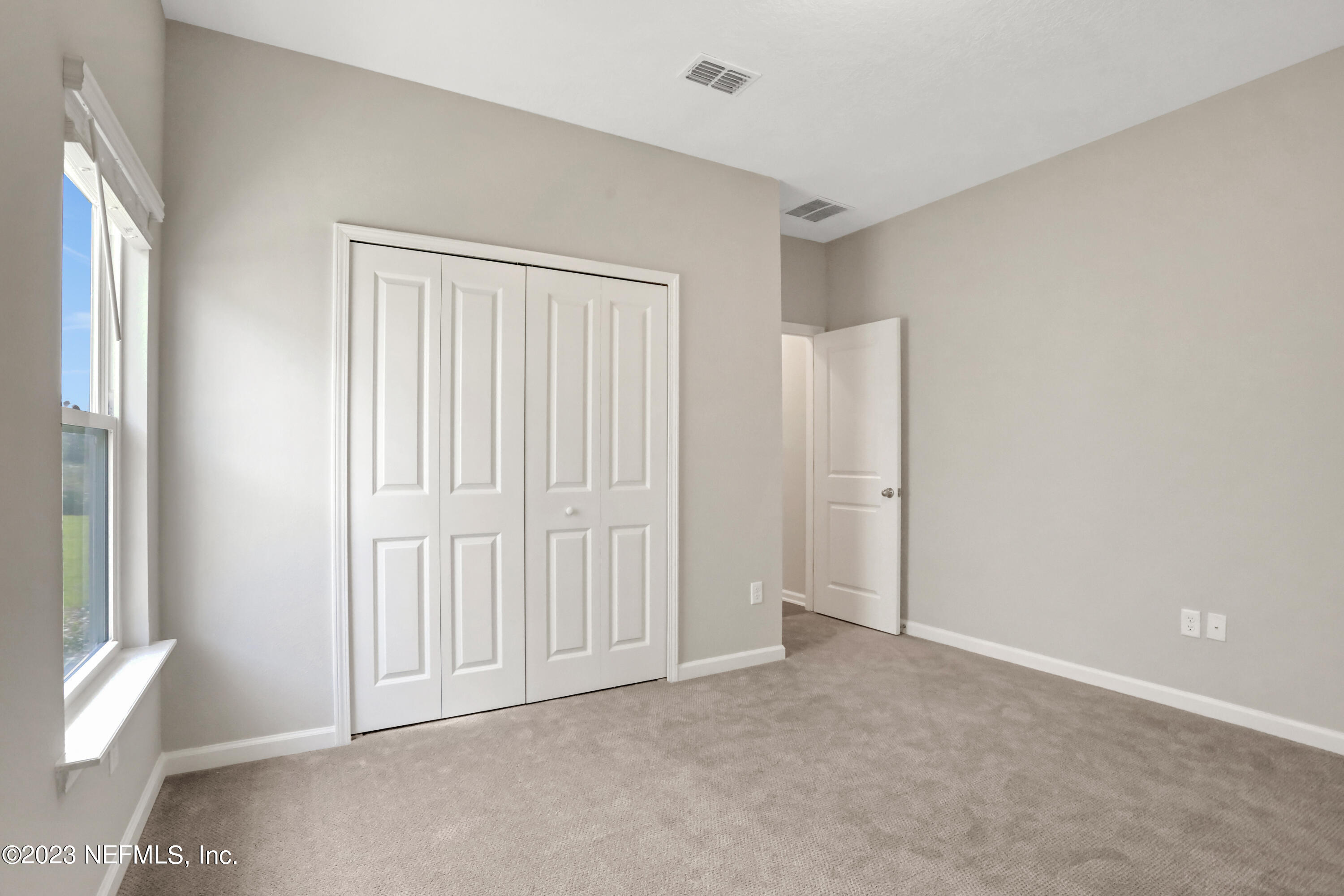 152 Torres Trace St. Augustine, FL 32095 - Photo 17 of 32 an empty room with windows