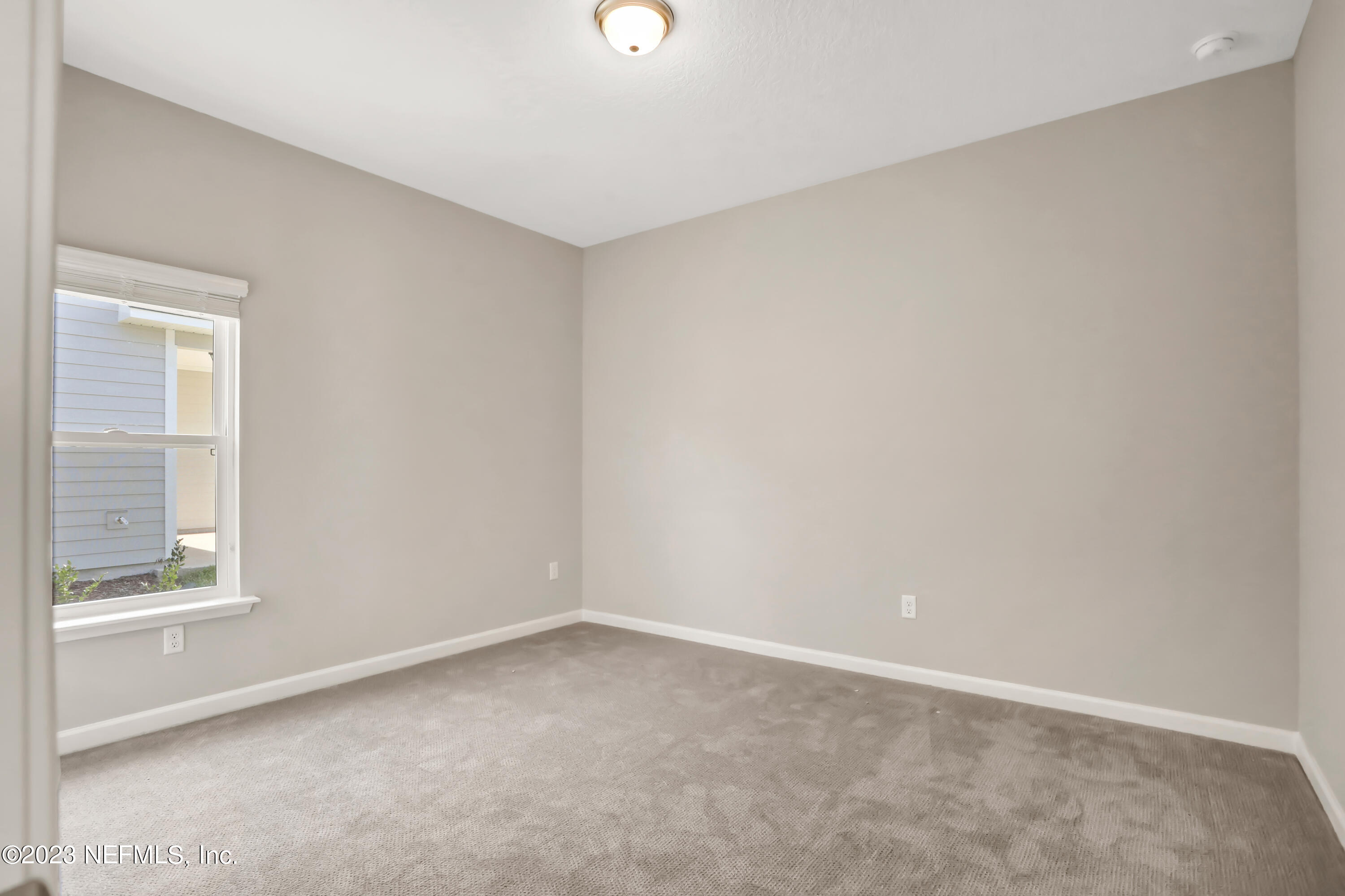 152 Torres Trace St. Augustine, FL 32095 - Photo 18 of 32 an empty room with a window