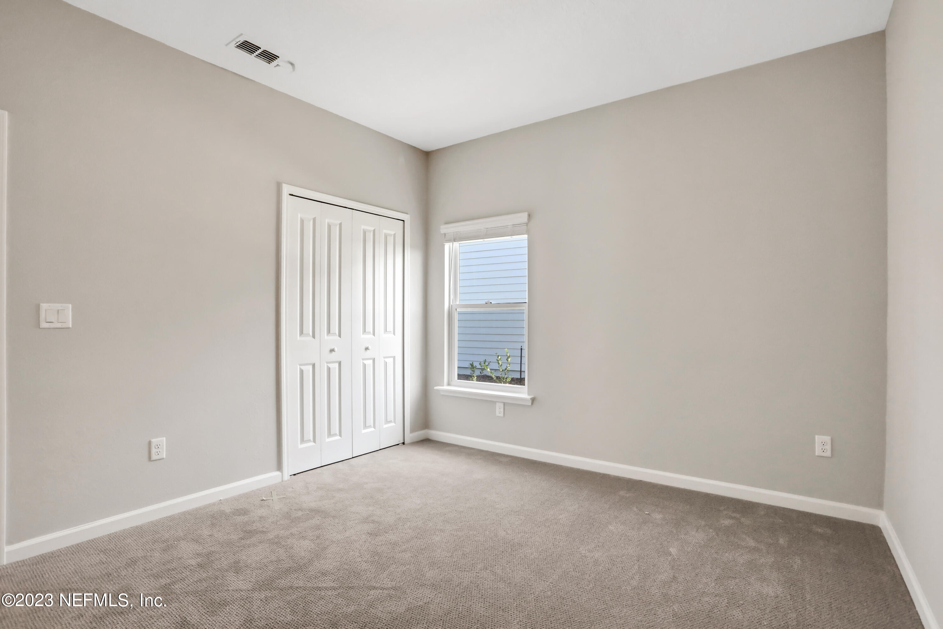 152 Torres Trace St. Augustine, FL 32095 - Photo 19 of 32 a view of an empty room with a window