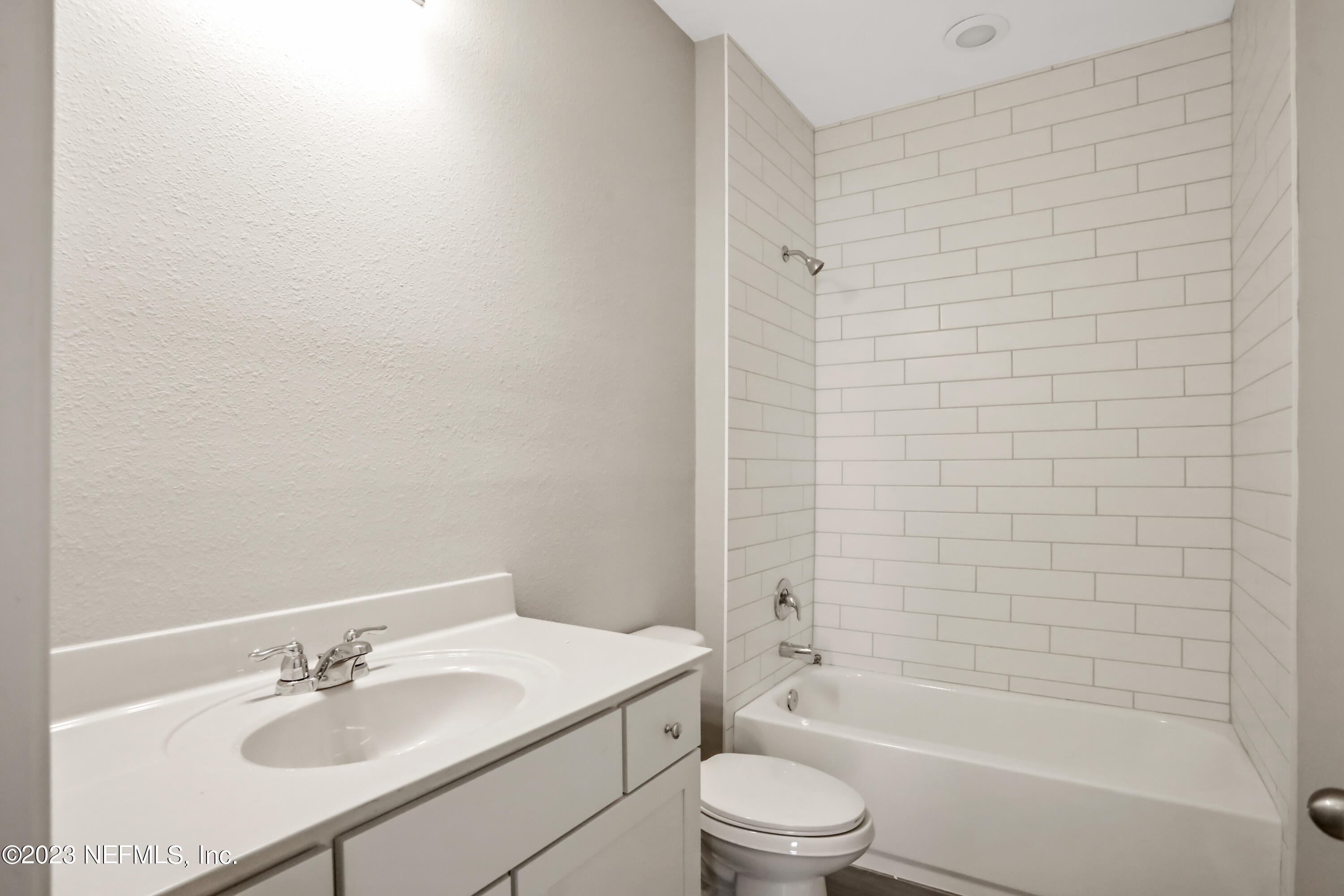 152 Torres Trace St. Augustine, FL 32095 - Photo 20 of 32 a bathroom with a bathtub shower sink vanity and toilet