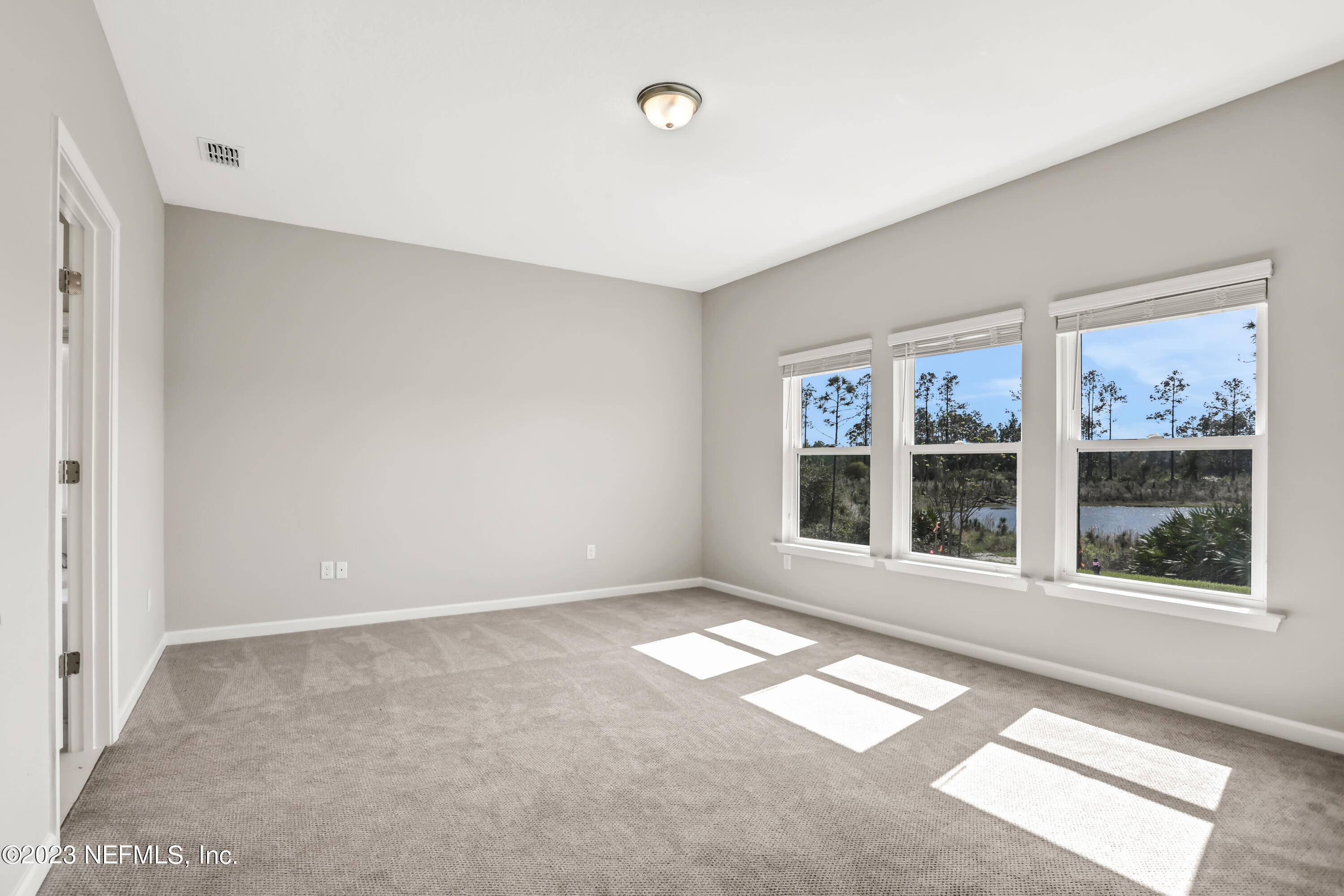 152 Torres Trace St. Augustine, FL 32095 - Photo 21 of 32 a view of an empty room with a window