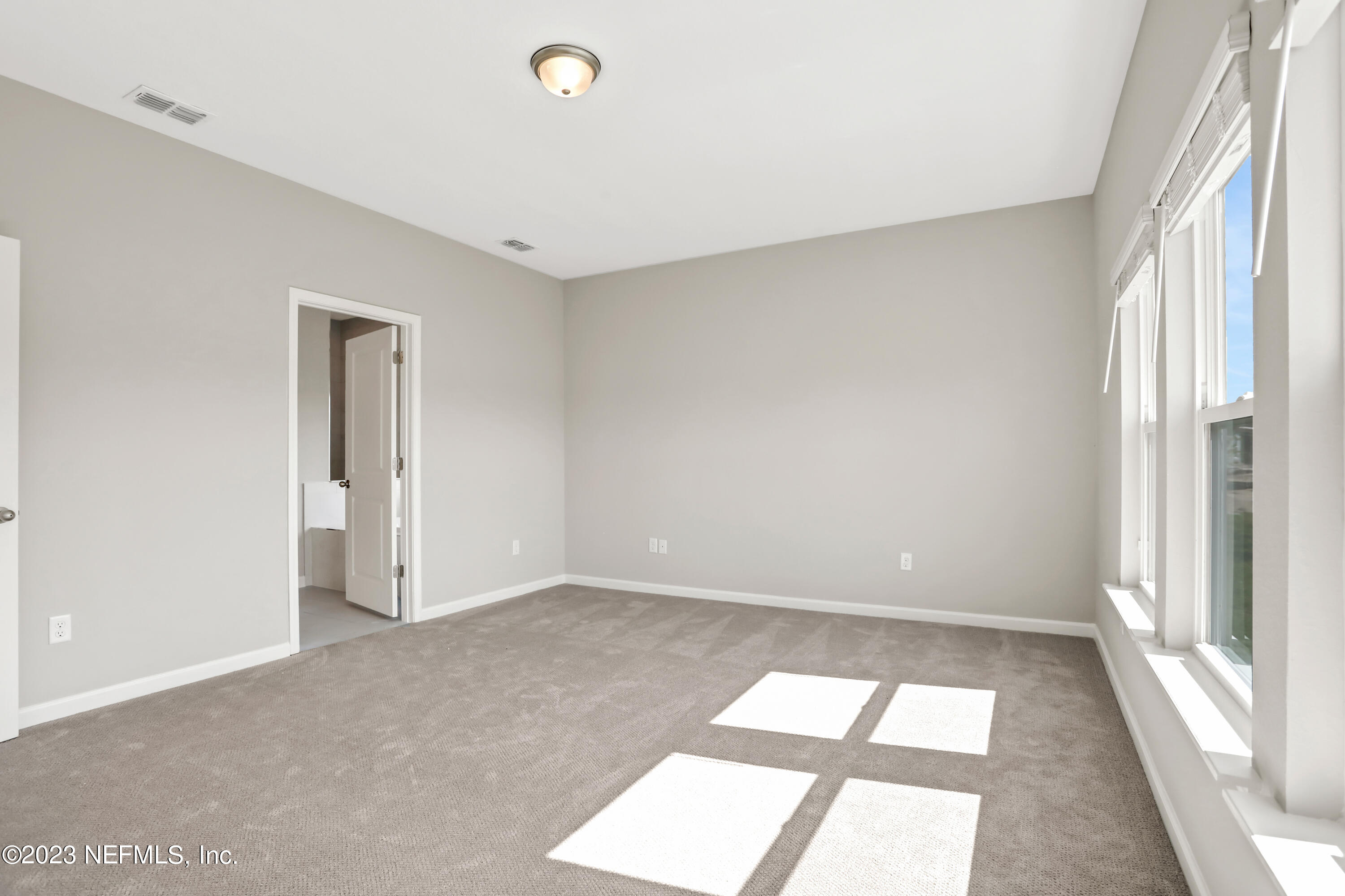 152 Torres Trace St. Augustine, FL 32095 - Photo 22 of 32 a view of an empty room and window