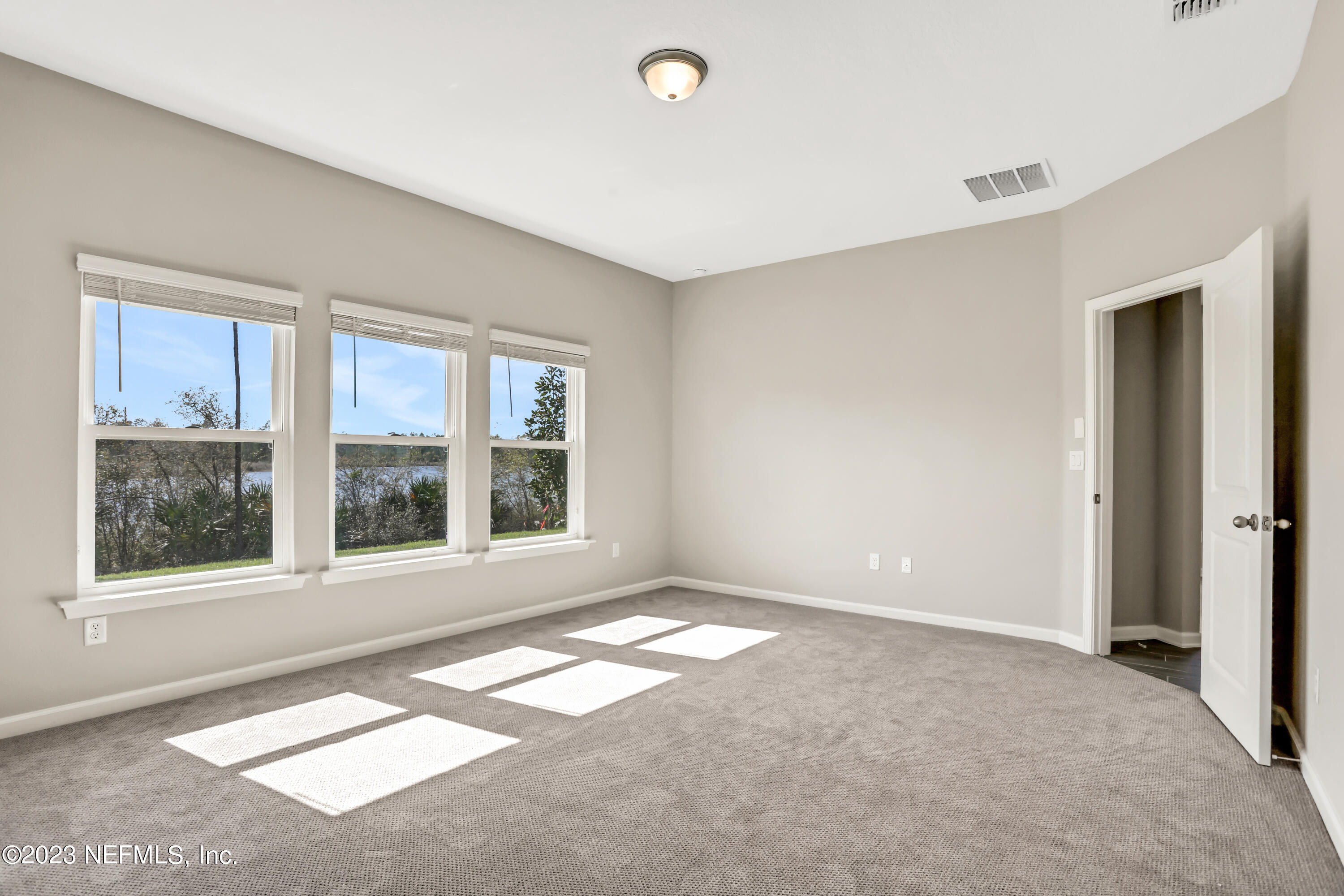 152 Torres Trace St. Augustine, FL 32095 - Photo 24 of 32 a view of an empty room with a window