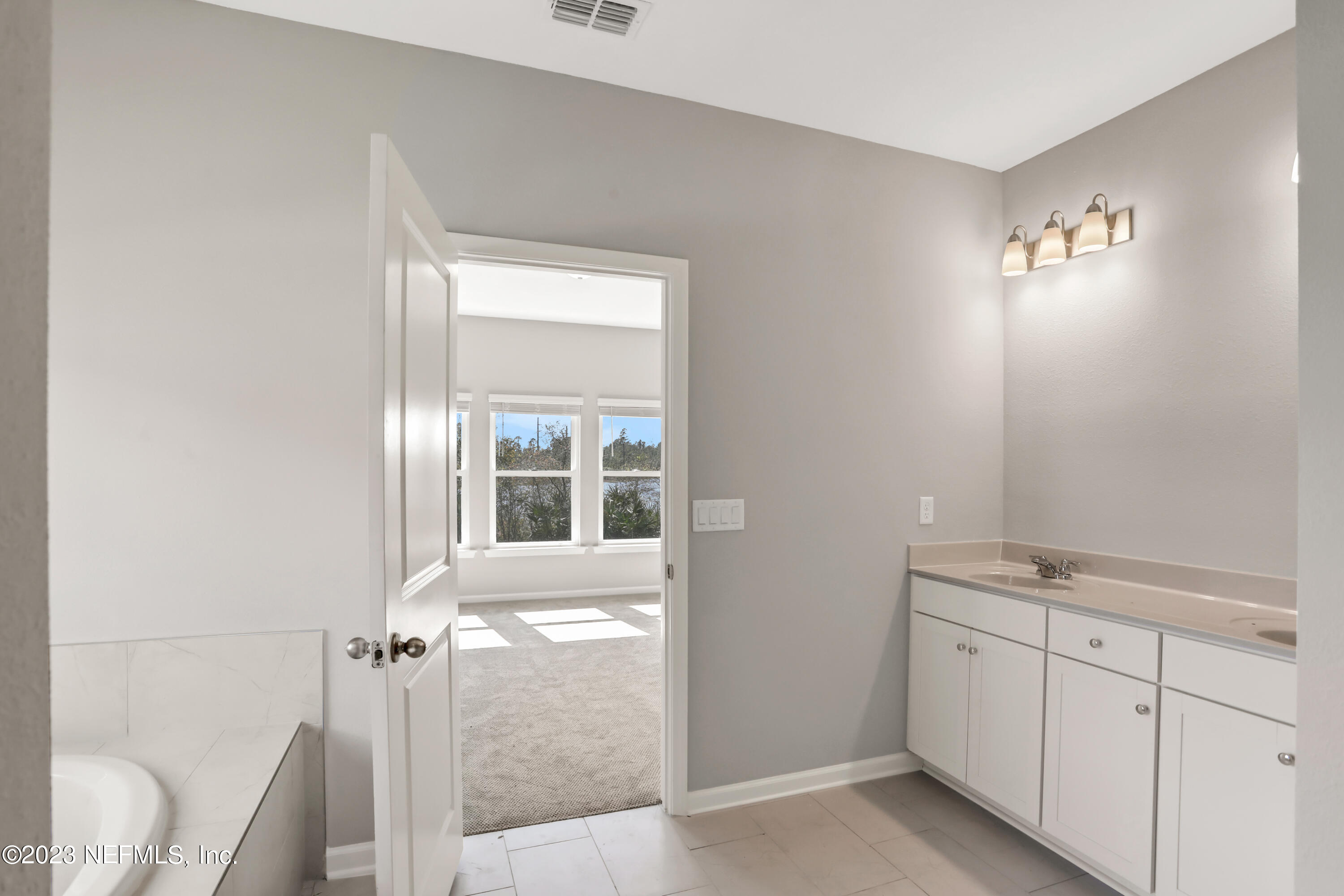 152 Torres Trace St. Augustine, FL 32095 - Photo 28 of 32 a view of a bathroom with a sink
