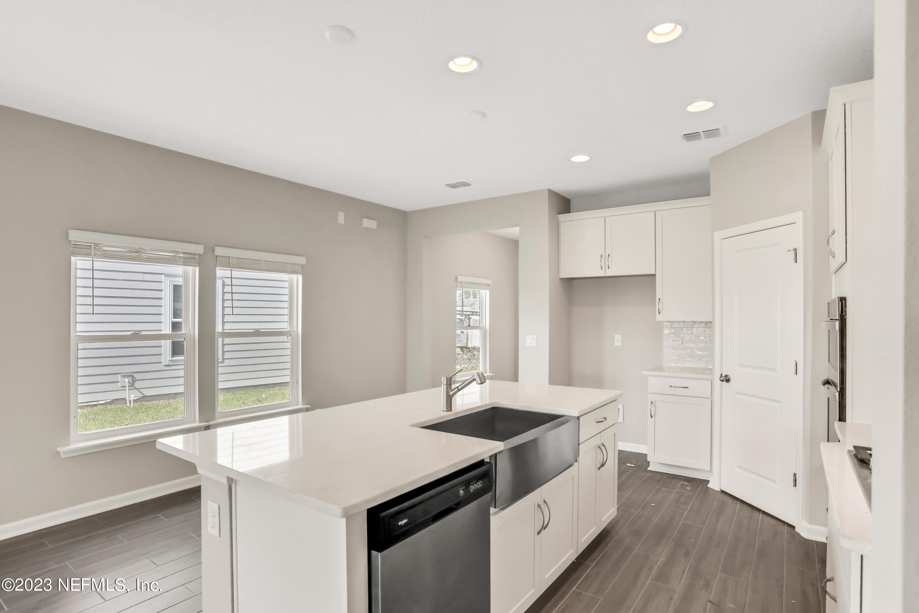 152 Torres Trace St. Augustine, FL 32095 - Photo 9 of 32 a kitchen with granite countertop a sink and a stove top oven