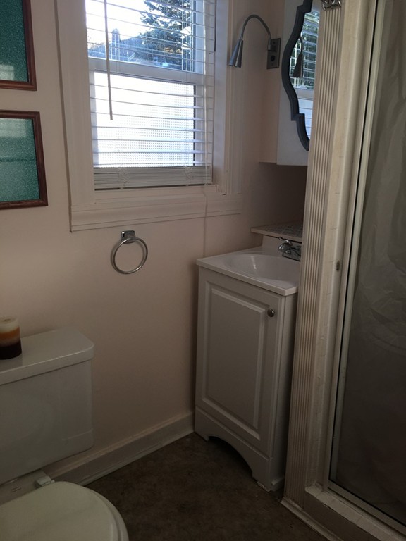 132 Windemere Street Springfield, MA 01104 - Photo 16 of 20 a bathroom with a toilet sink and window