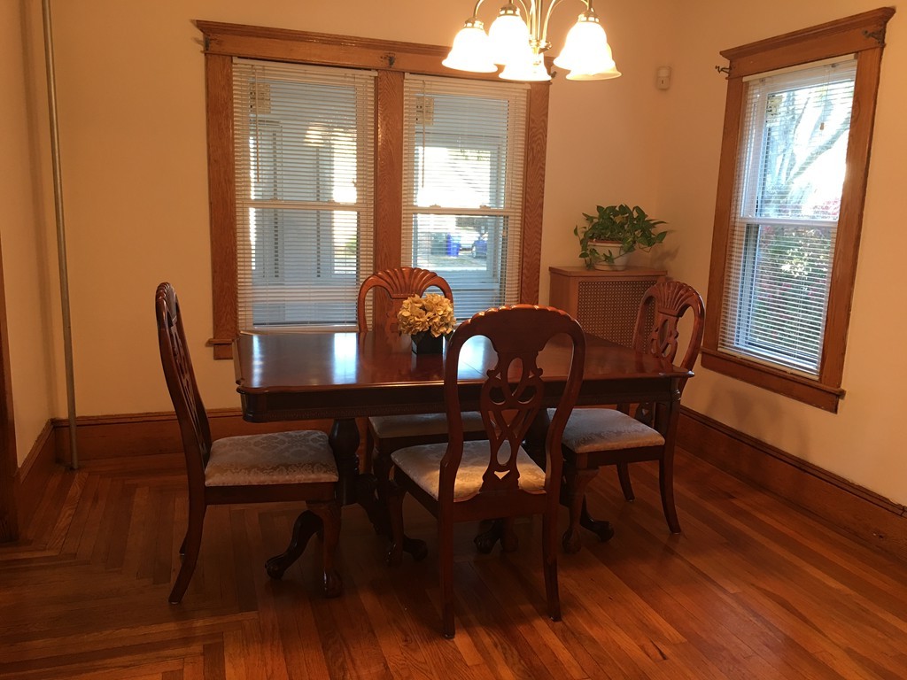132 Windemere Street Springfield, MA 01104 - Photo 6 of 20 a view of a dining room with furniture window and wooden floor