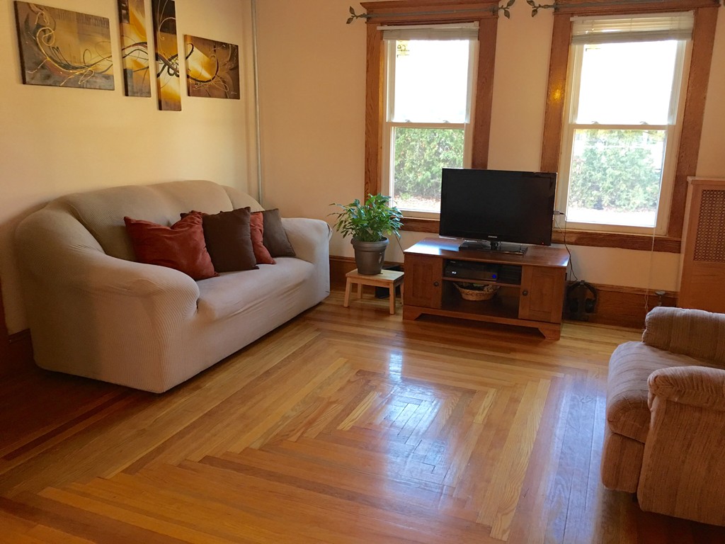 132 Windemere Street Springfield, MA 01104 - Photo 7 of 20 a living room with furniture and a flat screen tv