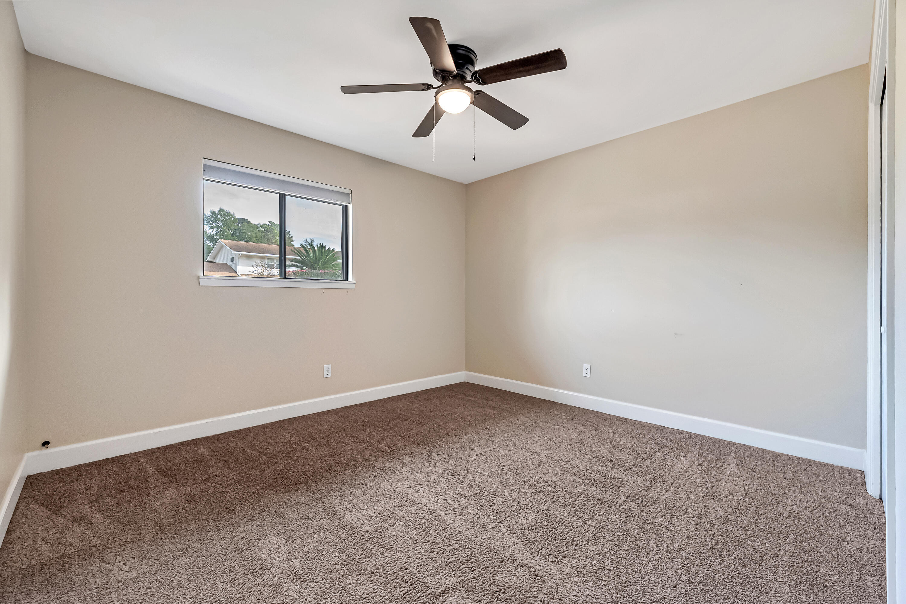613 Caribbean Way Niceville, FL 32578 - Photo 12 of 27 wooden floor in an empty room