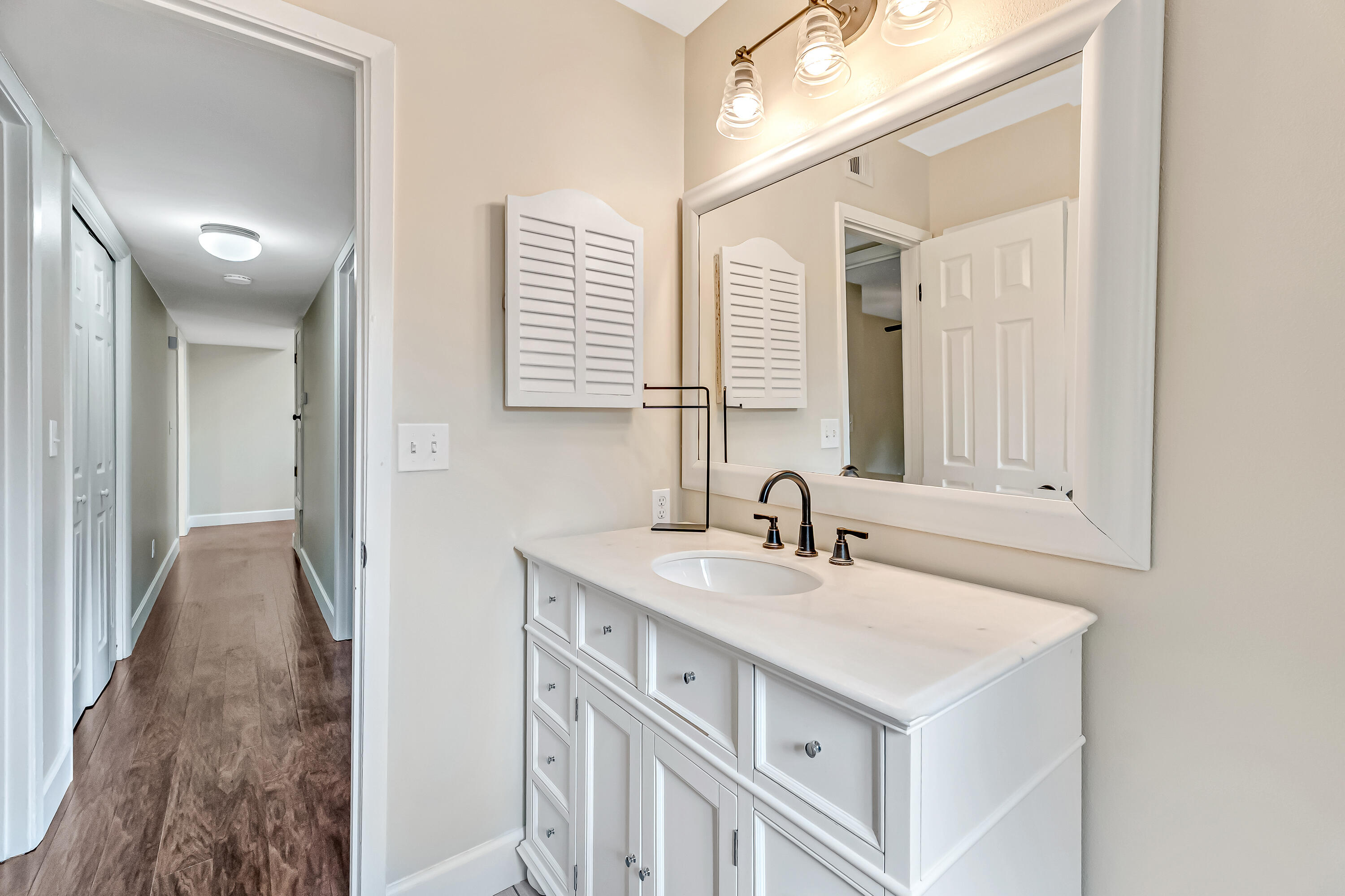 613 Caribbean Way Niceville, FL 32578 - Photo 15 of 27 a bathroom with a sink and a mirror