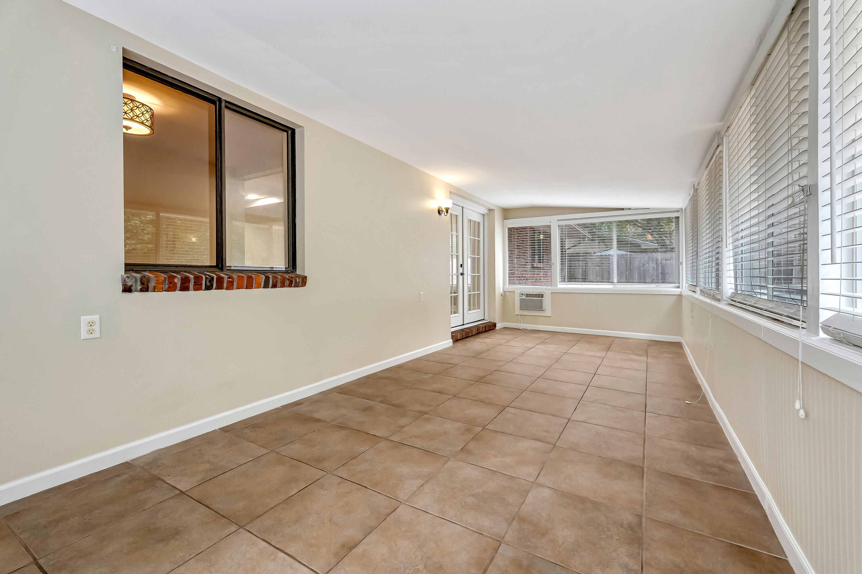 613 Caribbean Way Niceville, FL 32578 - Photo 22 of 27 an empty room with windows and entrance