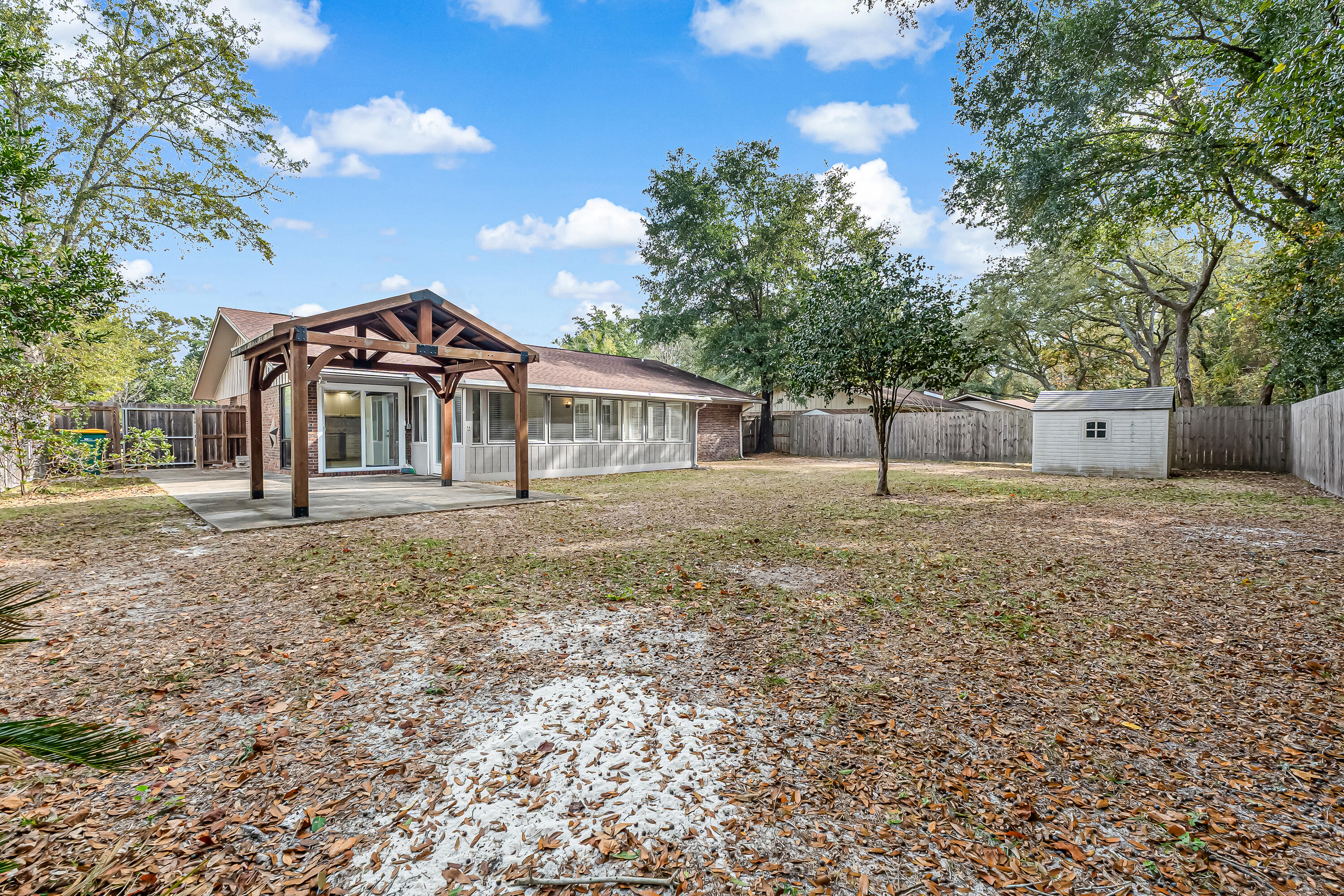 613 Caribbean Way Niceville, FL 32578 - Photo 23 of 27 a front view of a house with a yard