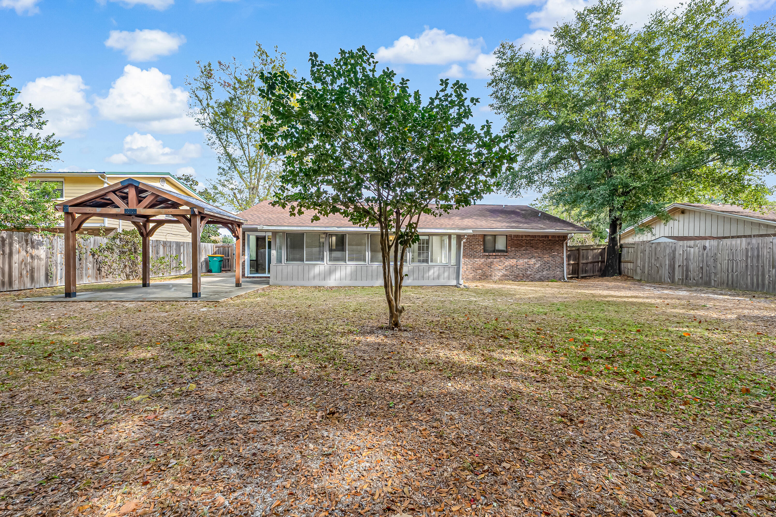 613 Caribbean Way Niceville, FL 32578 - Photo 24 of 27 a front view of a house with garden