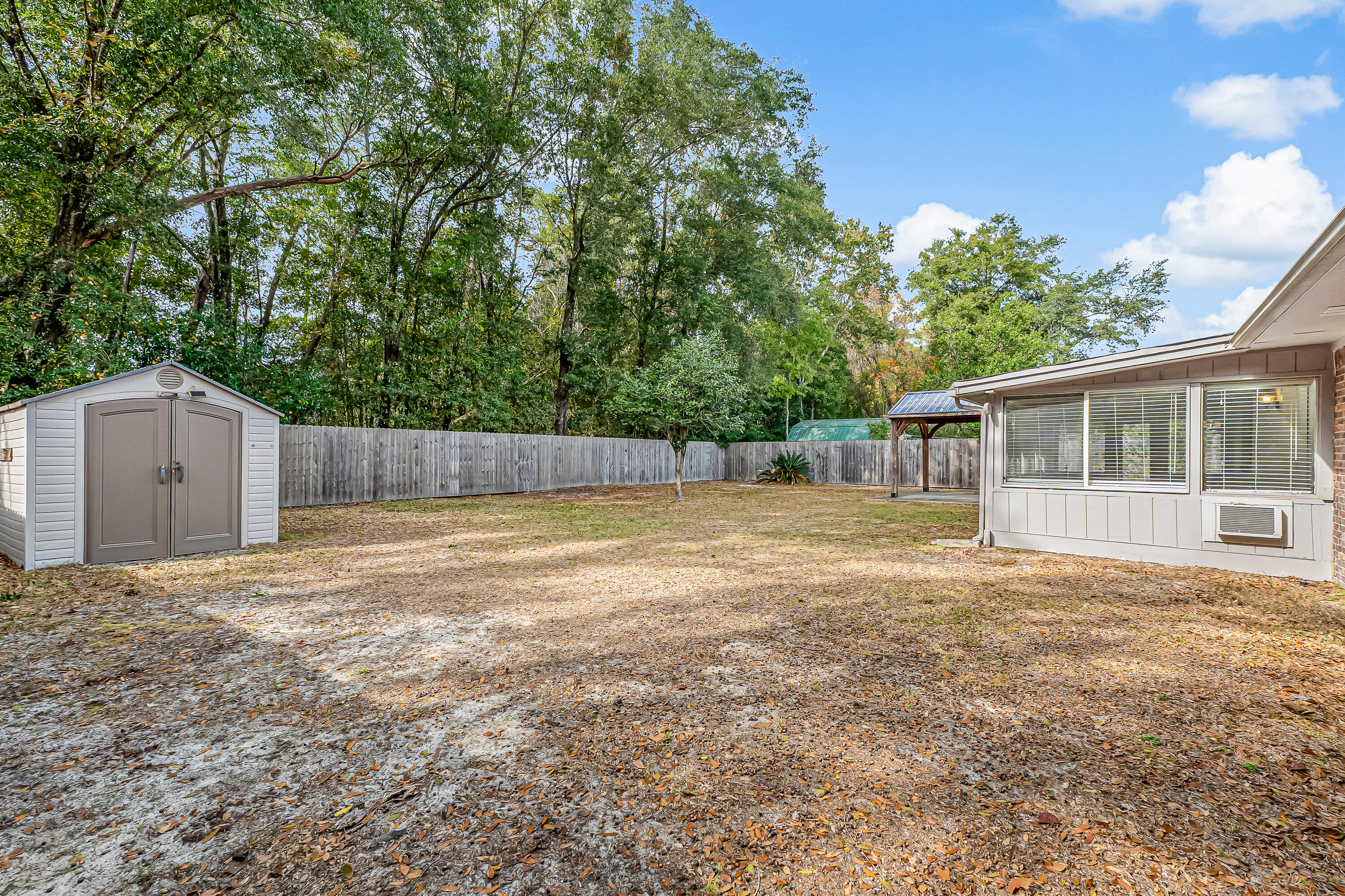 613 Caribbean Way Niceville, FL 32578 - Photo 26 of 27 a swimming pool with wooden fence