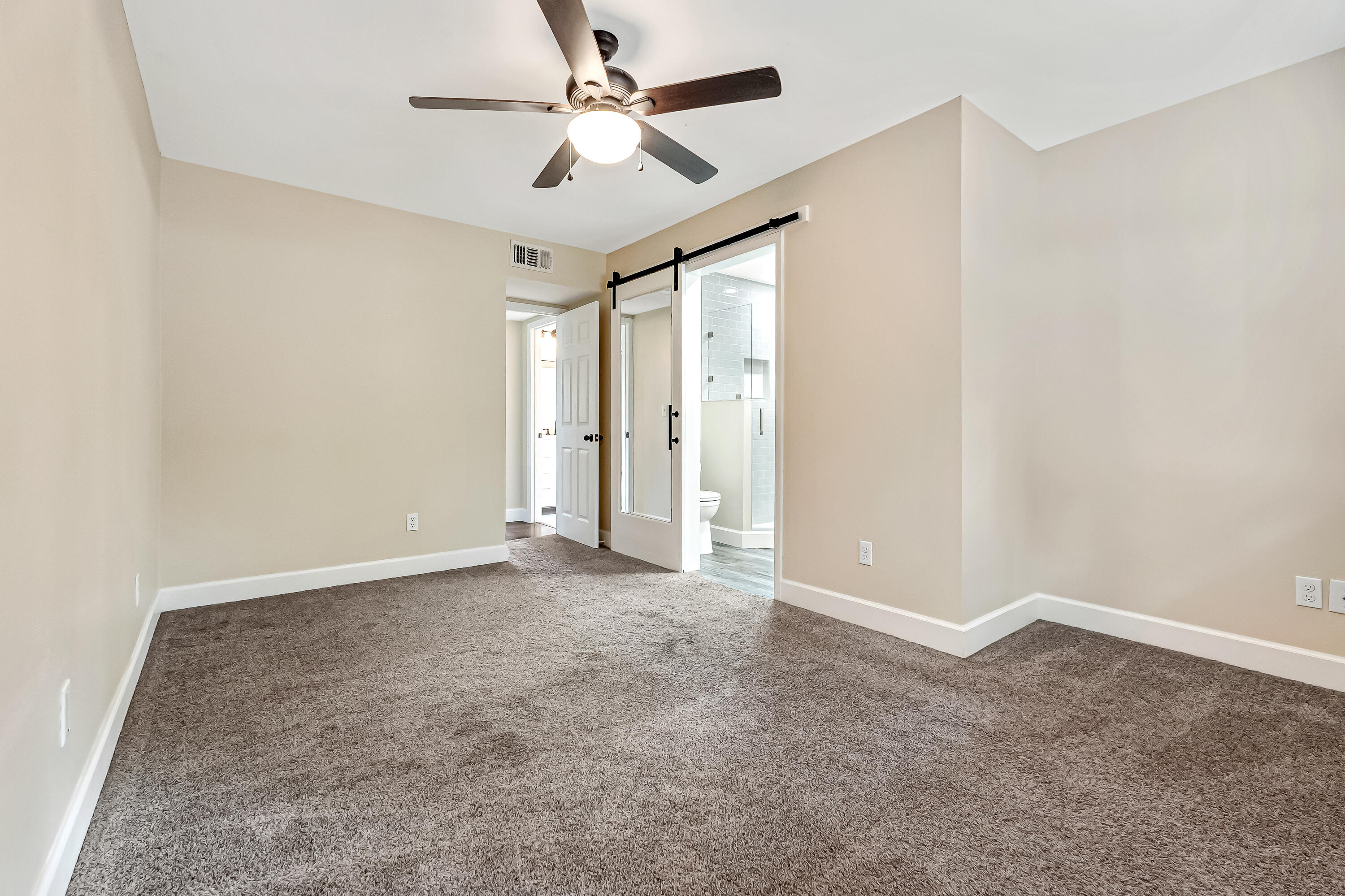 613 Caribbean Way Niceville, FL 32578 - Photo 7 of 27 an empty room with fan and a ceiling fan