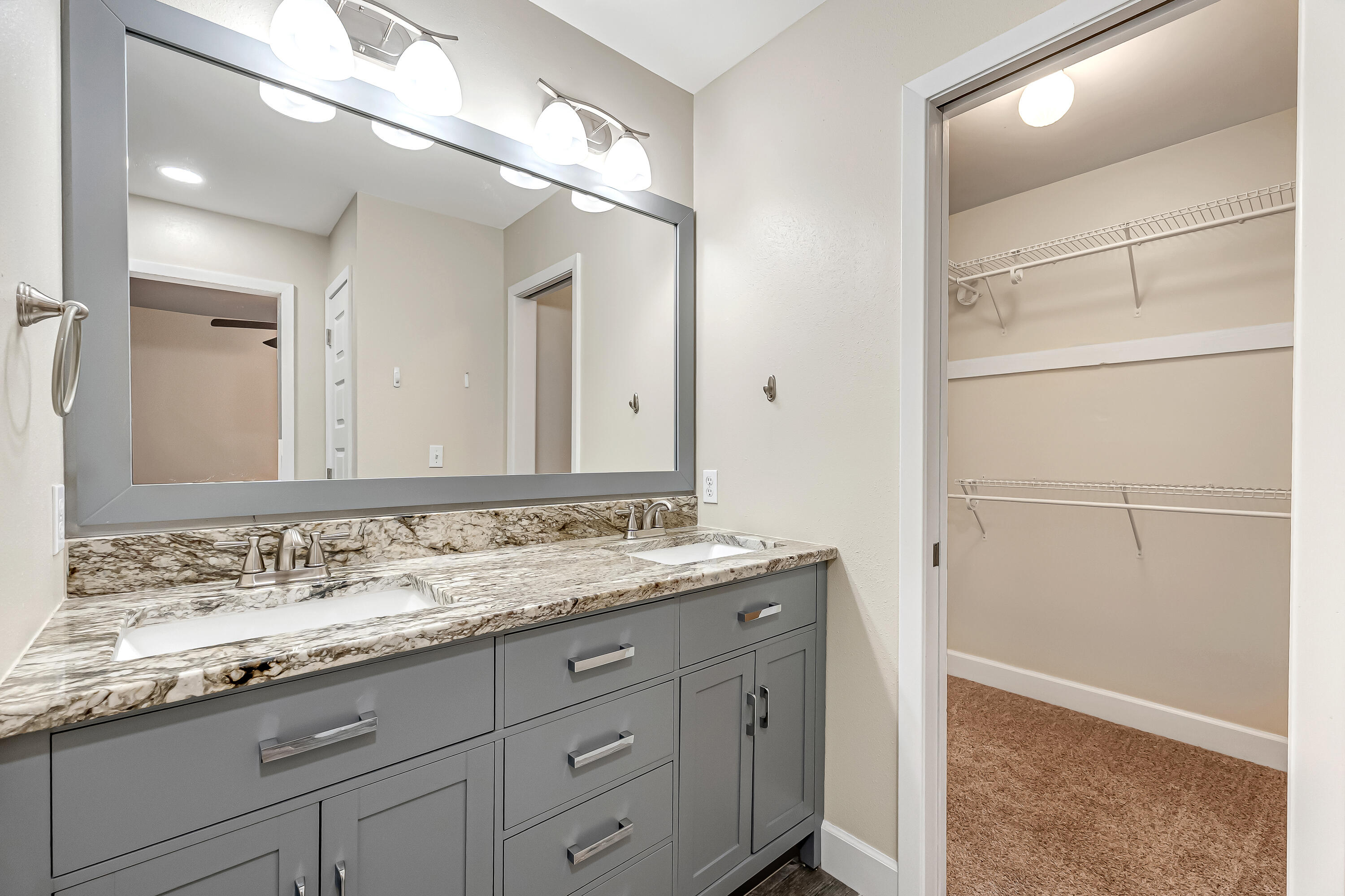 613 Caribbean Way Niceville, FL 32578 - Photo 9 of 27 a bathroom with a granite countertop sink and a mirror