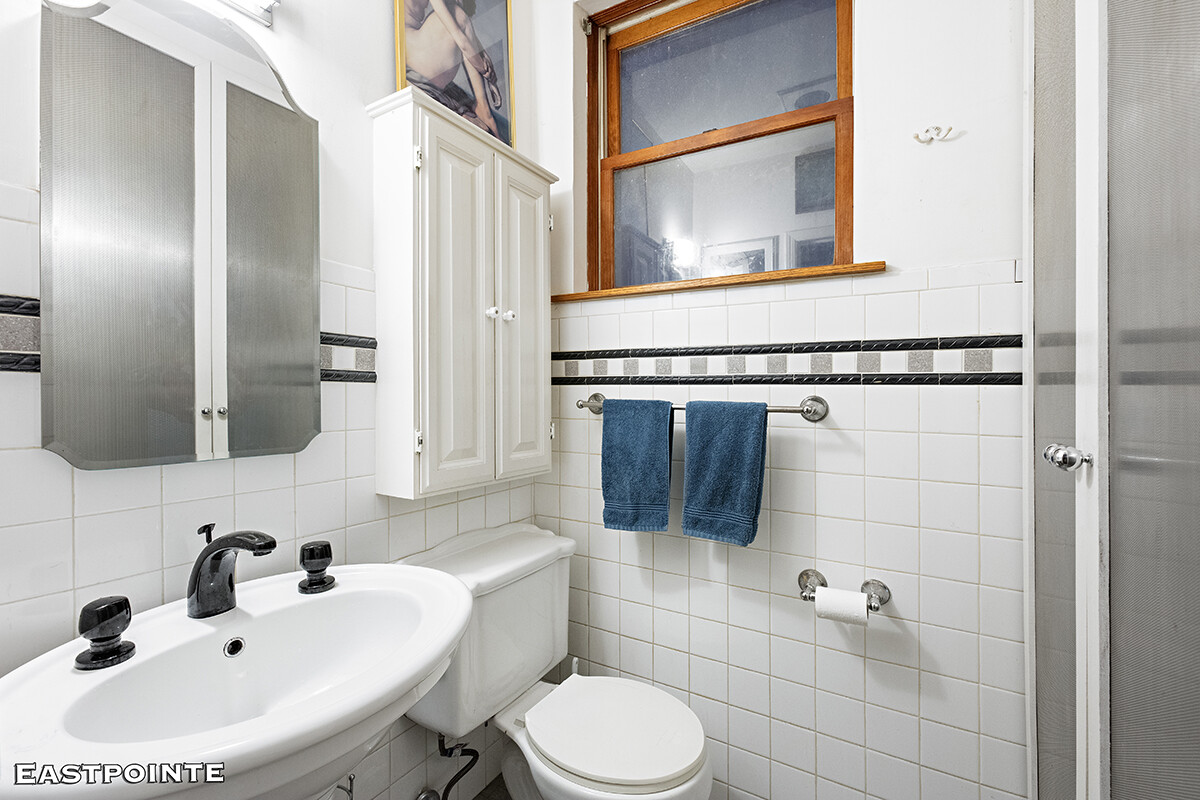 335 West 21st Street, Unit F/E Manhattan, NY 10011 - Photo 7 of 10 a bathroom with a sink toilet and shower