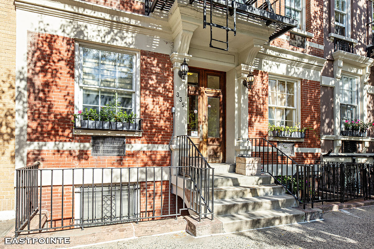 335 West 21st Street, Unit F/E Manhattan, NY 10011 - Photo 9 of 10 a view of a brick house with large windows