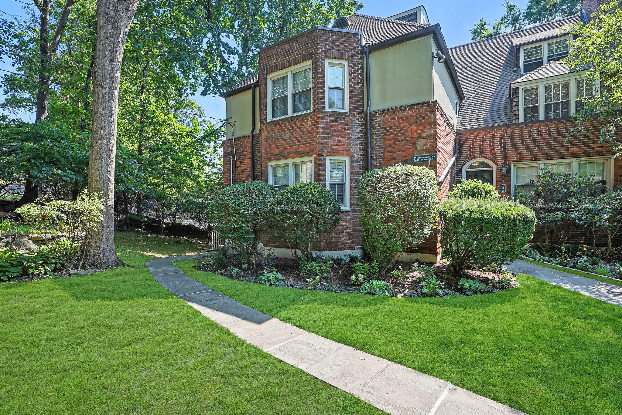 52 Underhill Road, Unit 2B Scarsdale, NY 10583 - Photo 1 of 1 a front view of a house with a yard