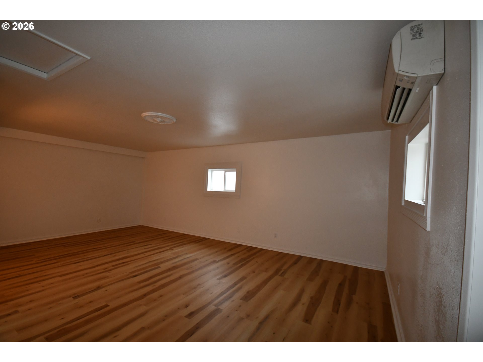 918 Snipes Street The Dalles, OR 97058 - Photo 18 of 47 a view of an empty room and wooden floor