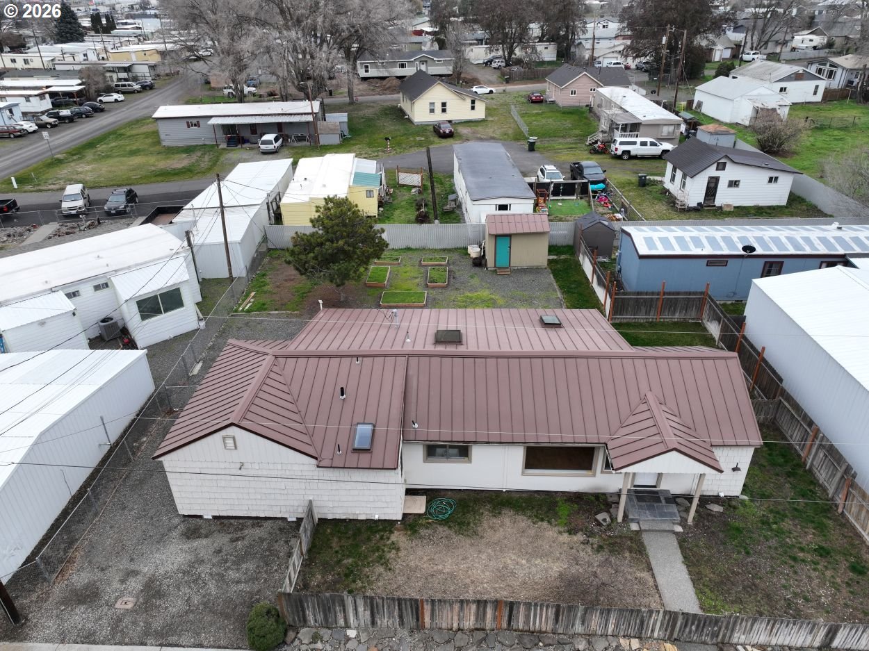 918 Snipes Street The Dalles, OR 97058 - Photo 3 of 47 a view of a patio with table and chairs with wooden floor and fence