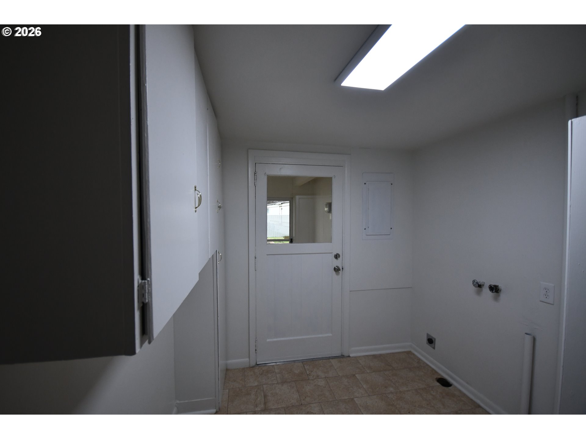 918 Snipes Street The Dalles, OR 97058 - Photo 34 of 47 a view of an empty room with wooden floor