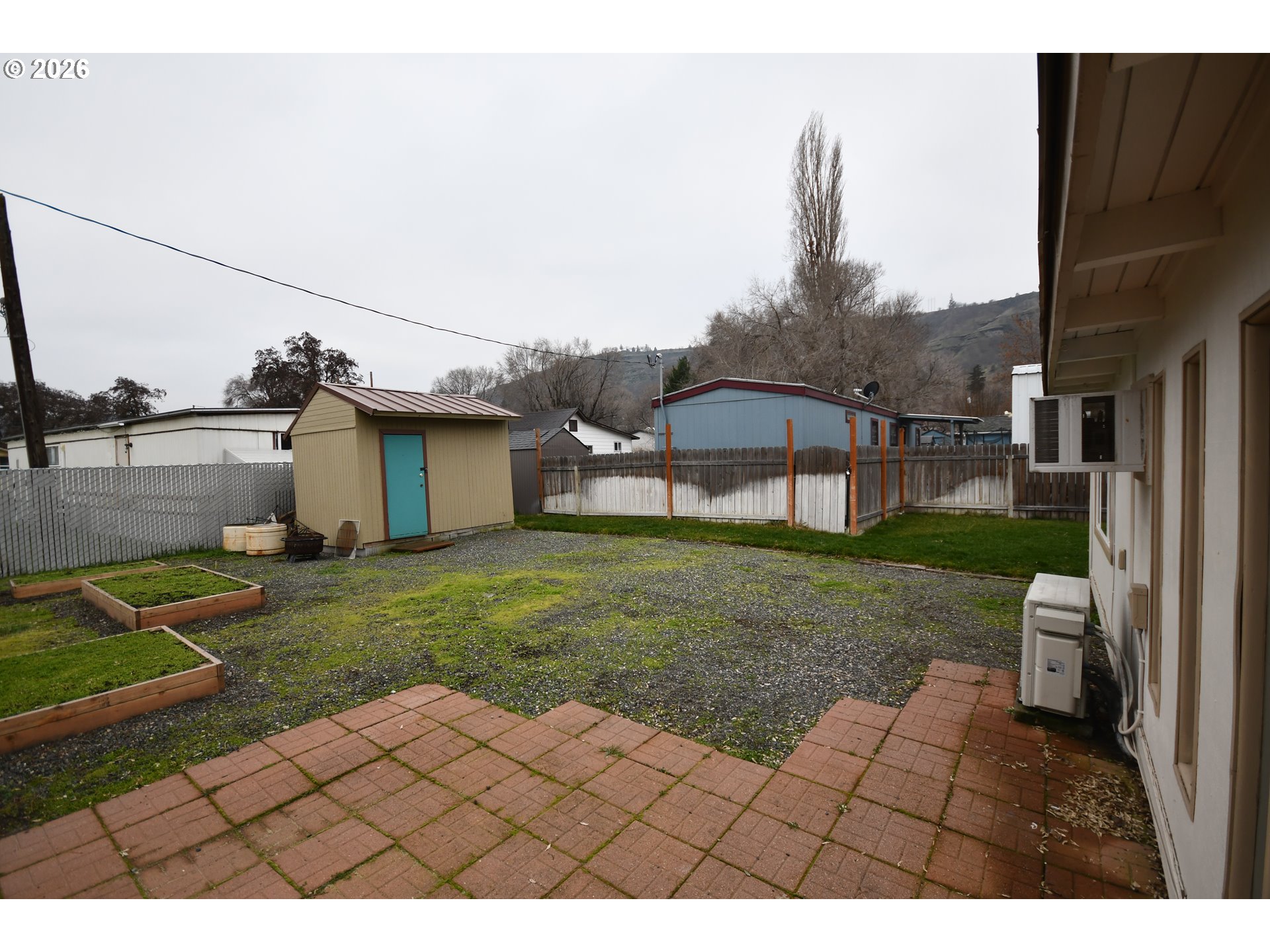 918 Snipes Street The Dalles, OR 97058 - Photo 35 of 47 a view of a house with a yard
