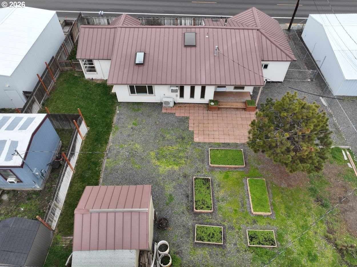 918 Snipes Street The Dalles, OR 97058 - Photo 4 of 47 an aerial view of a house with garden space and a car parked