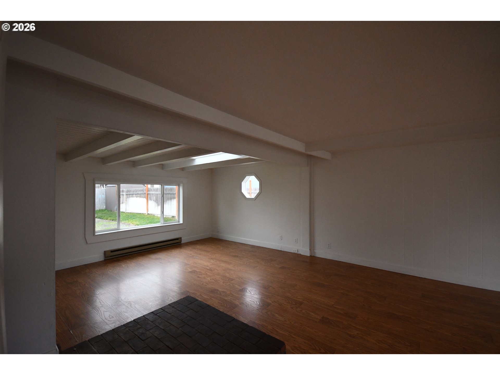 918 Snipes Street The Dalles, OR 97058 - Photo 8 of 47 a view of empty room with wooden floor