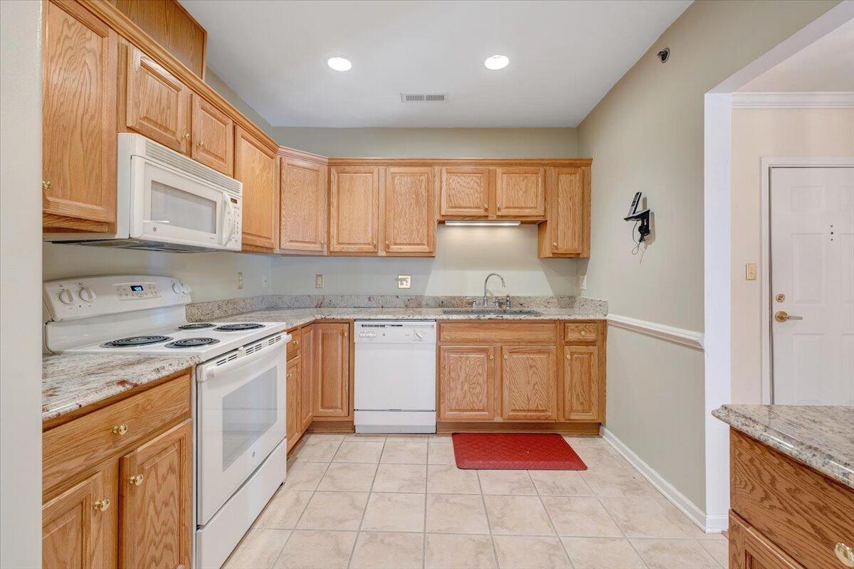 4448 Pheasant Ridge Road, Unit 307 Roanoke, VA 24014 - Photo 13 of 30 a kitchen with stainless steel appliances granite countertop a stove and a sink