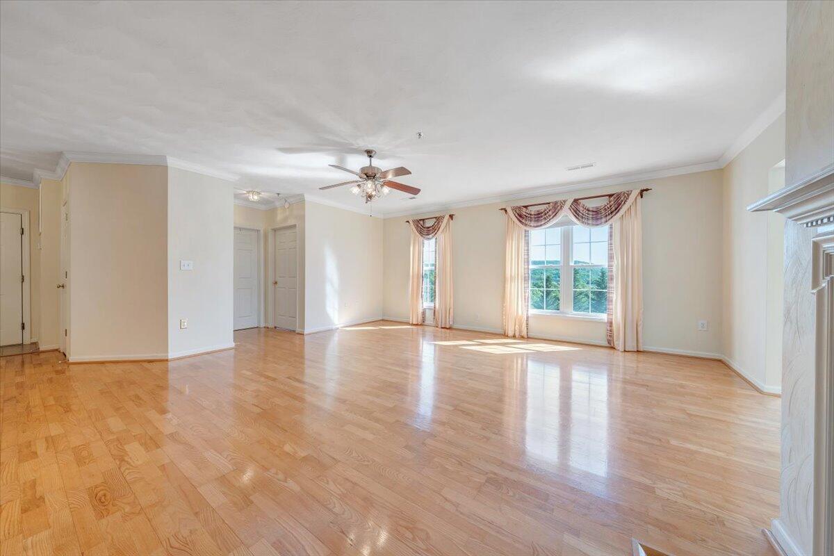 4448 Pheasant Ridge Road, Unit 307 Roanoke, VA 24014 - Photo 16 of 30 a view of an empty room with a window and wooden floor