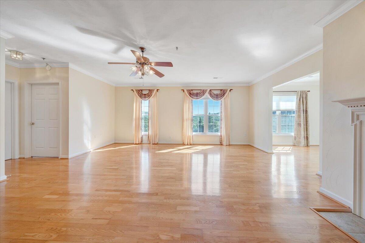 4448 Pheasant Ridge Road, Unit 307 Roanoke, VA 24014 - Photo 18 of 30 a view of an empty room with window and wooden floor